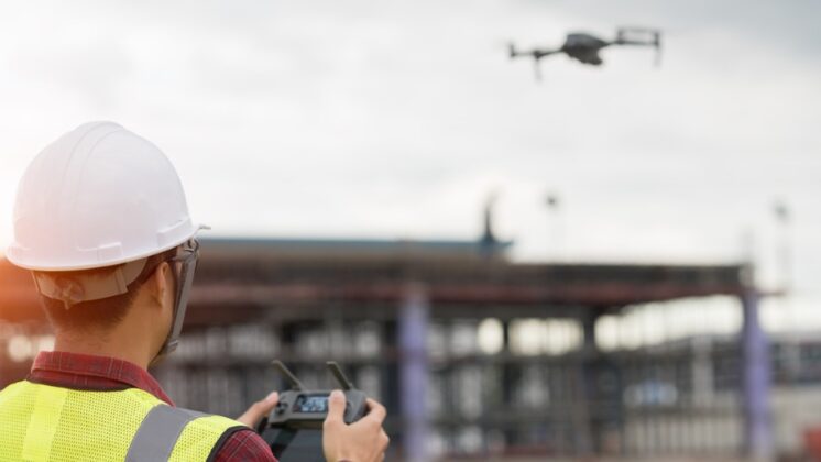 A man using drone technology at workolo