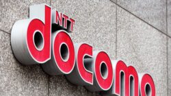 An outdoor wall shows the NTT docomo logo