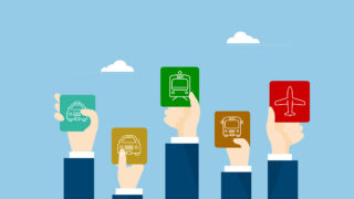 Digitalization Is Changing One of Japan’s Biggest Railway Operators Several animated arms hold up DX travel passes for various transportation