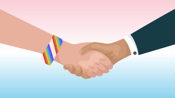 A businessman and member of the LGBTQ+ community shake hands over a background with the colors of the transgender pride flag for allyship in the workplace