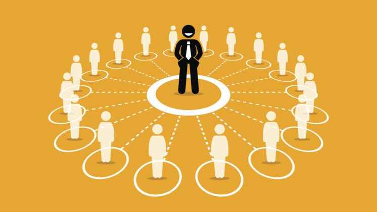 A businessman stands among an evenly distributed workforce on a gold background