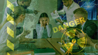 6 More Toxic Workplace Practices That Scare Employees Off Woman at work holds her head in a toxic workplace as her coworkers crowd around her shouting