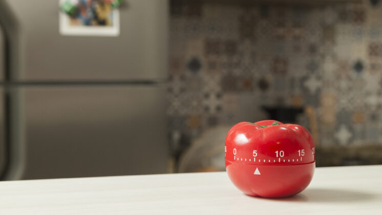 A tomato kitchen timer, from which the Pomodoro Technique gets its name
