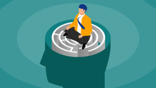 How to Use Meditation at Work for a More Productive 2023 Businessman meditating cross-legged pensive on brain maze