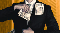 A man wearing a business suit filled with cash.