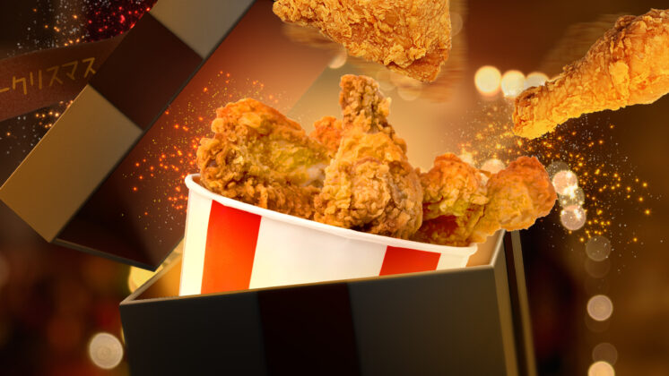 A bucket of KFC for Christmas in Japan under a Christmas tree.
